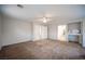 Spacious living room with carpet, natural lighting, and access to bedrooms and bathrooms at 54 Blue Fountain Ct, Henderson, NV 89012