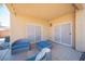 Cozy covered patio featuring comfortable seating and stylish decor, perfect for outdoor relaxation at 54 Blue Fountain Ct, Henderson, NV 89012