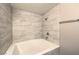 Modern bathroom featuring a soaking tub with stylish tile surround and a brushed chrome shower head at 541 Indian Bluff St # 201, Las Vegas, NV 89145