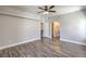 Relaxing bedroom with ceiling fan, wood-look floors and ensuite bathroom at 541 Indian Bluff St # 201, Las Vegas, NV 89145