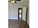 Bright bedroom featuring gray walls, wood flooring, and a ceiling fan at 541 Indian Bluff St # 201, Las Vegas, NV 89145