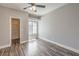 Neutral bedroom featuring wood-look floors, ample natural light, and a walk-in closet at 541 Indian Bluff St # 201, Las Vegas, NV 89145