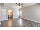 Charming bedroom featuring wood-look floors, an ensuite bathroom, and a ceiling fan at 541 Indian Bluff St # 201, Las Vegas, NV 89145