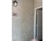 Apartment 201 features a textured exterior wall with a sconce and a white door at 541 Indian Bluff St # 201, Las Vegas, NV 89145