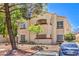 Comfortable condo with two-tone exterior, desert landscaping, and covered balcony at 541 Indian Bluff St # 201, Las Vegas, NV 89145
