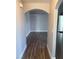 Hallway features an arched entrance and sleek, modern wood-look floors at 541 Indian Bluff St # 201, Las Vegas, NV 89145