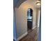 Hallway with archway leading to the kitchen, showcasing stylish and wood-look floors at 541 Indian Bluff St # 201, Las Vegas, NV 89145