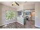 Stylish kitchen with gray cabinets, breakfast bar, modern appliances, and wood floors at 541 Indian Bluff St # 201, Las Vegas, NV 89145