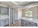 Modern kitchen with grey cabinetry, stainless appliances and white countertops at 541 Indian Bluff St # 201, Las Vegas, NV 89145