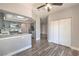 Bright kitchen featuring gray cabinets, stainless appliances, breakfast bar, and wood floors at 541 Indian Bluff St # 201, Las Vegas, NV 89145
