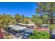 Community parking area with mature trees and covered parking spaces at 541 Indian Bluff St # 201, Las Vegas, NV 89145