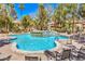 Inviting community pool with rock waterfall feature and ample seating, perfect for relaxation at 541 Indian Bluff St # 201, Las Vegas, NV 89145