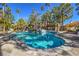 Beautiful community pool with a rock waterfall, offering a refreshing oasis for residents at 541 Indian Bluff St # 201, Las Vegas, NV 89145