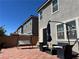 Outdoor patio with a swing, umbrella, brick pavers, and backyard furniture at 5550 Jinan St, Las Vegas, NV 89148