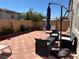 View of the backyard patio featuring brick pavers, seating, and patio furniture at 5550 Jinan St, Las Vegas, NV 89148