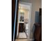 Bathroom with modern fixtures, dark wood vanity, and decorative gray bathmat at 5550 Jinan St, Las Vegas, NV 89148