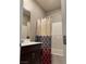 Bathroom features a shower-tub combo, and single sink vanity at 5550 Jinan St, Las Vegas, NV 89148