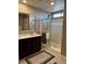Bathroom showcasing a glass enclosed shower and granite countertop at 5550 Jinan St, Las Vegas, NV 89148