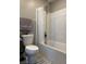 A bathroom featuring a white tub-shower with a white shower curtain and a matching toilet at 5550 Jinan St, Las Vegas, NV 89148