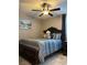 Cozy bedroom featuring a teddy bear on the bed and modern ceiling fan at 5550 Jinan St, Las Vegas, NV 89148