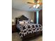 Well-lit bedroom showcasing a large bed and matching nightstands at 5550 Jinan St, Las Vegas, NV 89148