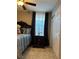 Bedroom featuring a three-drawer nightstand and light filtering window treatment at 5550 Jinan St, Las Vegas, NV 89148