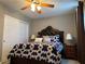 Bedroom featuring a ceiling fan, stylish lighting, and closet at 5550 Jinan St, Las Vegas, NV 89148