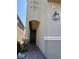 Close up of the front entrance featuring an arched entry and desert landscaping at 5550 Jinan St, Las Vegas, NV 89148