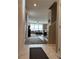 Entryway with white marble tile, and view into the living room at 5550 Jinan St, Las Vegas, NV 89148