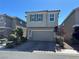 Two-story home featuring a two-car garage, well-maintained landscaping, and a neutral color palette at 5550 Jinan St, Las Vegas, NV 89148