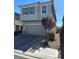 Two-story home with a two-car garage and desert landscaping at 5550 Jinan St, Las Vegas, NV 89148