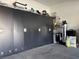 Garage with storage cabinets, water heater, and water filtration system at 5550 Jinan St, Las Vegas, NV 89148