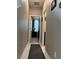 Hallway with tile flooring leads to bedrooms and bathrooms at 5550 Jinan St, Las Vegas, NV 89148