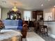 An open concept kitchen and dining room with a chandelier at 5550 Jinan St, Las Vegas, NV 89148