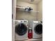 Laundry room with front-loading Samsung washer and dryer and wire shelving at 5550 Jinan St, Las Vegas, NV 89148