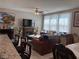 Cozy living room features a decorative fireplace, ceiling fan, and lots of natural light at 5550 Jinan St, Las Vegas, NV 89148