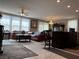 Living room featuring tile flooring, a chandelier, and lots of natural light at 5550 Jinan St, Las Vegas, NV 89148