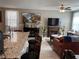 Inviting living room with modern ceiling fan, and decorative fireplace at 5550 Jinan St, Las Vegas, NV 89148