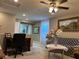 Versatile loft space offers a ceiling fan, study area, and comfortable seating at 5550 Jinan St, Las Vegas, NV 89148