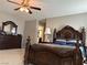 Comfortable main bedroom showing the dark finish furniture and neutral color walls at 5550 Jinan St, Las Vegas, NV 89148