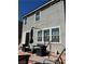 Back patio featuring red brick pavers, black patio furniture, and an umbrella at 5550 Jinan St, Las Vegas, NV 89148