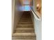 Carpeted stairway with white banister leading to the upper level at 5550 Jinan St, Las Vegas, NV 89148