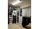 Walk-in closet featuring organized storage shelves and multiple hanging rods at 5550 Jinan St, Las Vegas, NV 89148
