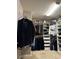 Walk-in closet with custom shelving and ample storage space for clothing and accessories at 5550 Jinan St, Las Vegas, NV 89148