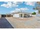 Expansive backyard with a covered patio, offering ample space for outdoor entertaining and relaxation at 564 Lampshire Ln, Pahrump, NV 89060