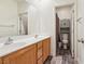 Bright bathroom featuring a double sink vanity, toilet, and modern fixtures at 564 Lampshire Ln, Pahrump, NV 89060