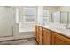Bright bathroom showcases double sinks, a vanity with modern fixtures, a shower, and a bathtub at 564 Lampshire Ln, Pahrump, NV 89060