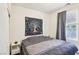 Comfortable bedroom with a queen bed and bright natural light from the window at 564 Lampshire Ln, Pahrump, NV 89060