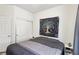Bedroom with closet and tree tapestry for comfort and style at 564 Lampshire Ln, Pahrump, NV 89060