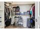 Organized walk-in closet with shelves, rods, and storage solutions for clothes and accessories at 564 Lampshire Ln, Pahrump, NV 89060